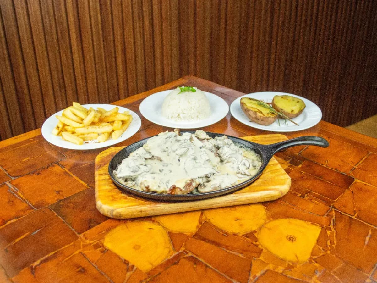 Churrasco en salsa de champiñones